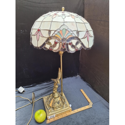 276 - A Tiffany Style heavy table Lamp with a Brass Base featuring a Bird Motif in Ireland. lovely quality... 