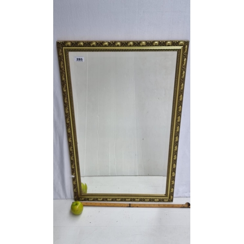 285 - A Large Bevelled Mirror with an Ornate Gilt Frame. Heavy, nice quality mirror.