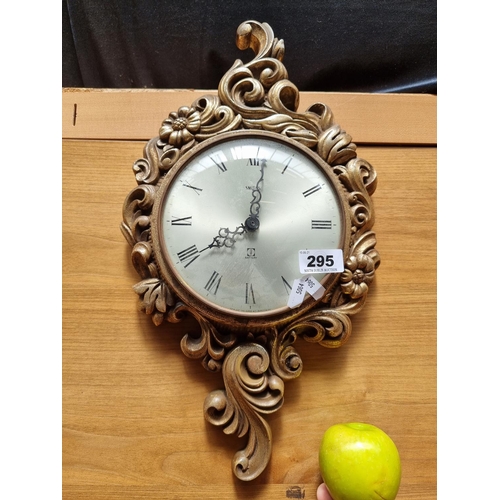 295 - An Elegant Highly Ornate Smiths Wall Clock