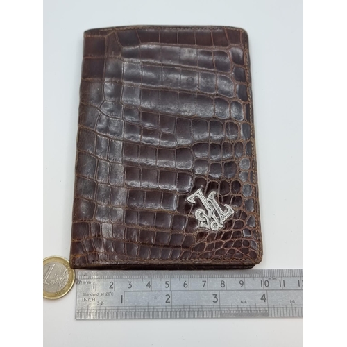 37 - Crocodile skin wallet with continental silver marks for wallet initials. Condition of wallet in good... 