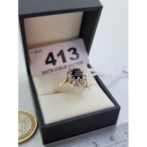 413 - A vintage 9 carat gold large sapphire cluster ring, in the Lady Diana style. Weight 2.8g, size L 1/2... 