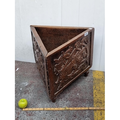 481 - An antique wooden triangular umbrella stand, decorated with beautiful Asian style dragon carvings on... 
