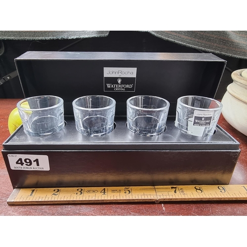 491 - A set of four Waterford crystal shot glass from a collaboration with John Rocha, presented as new in... 