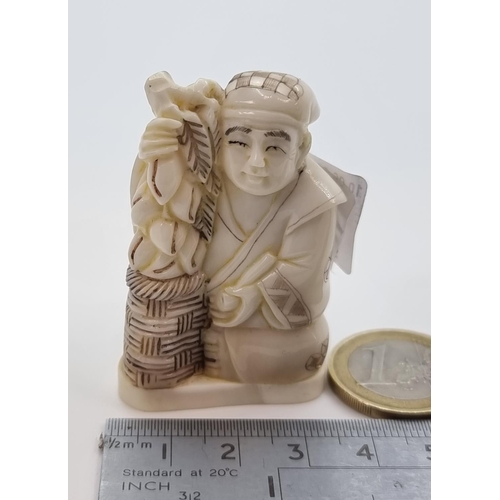 5 - A bone carved netsuke, with stamped maker's mark, of a gentleman figure seated. This piece is very i... 