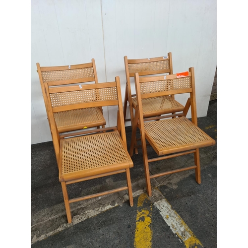 522 - A collection of vintage four good fold away chairs with kane work rattan backs and seats.