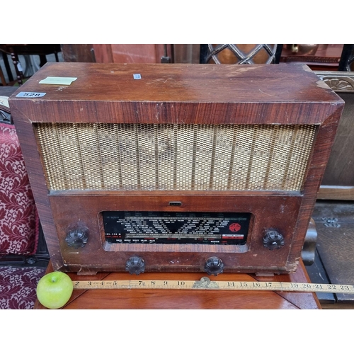 528 - A vintage wooden Pilot radio, C25069, including its original dials. In great condition.