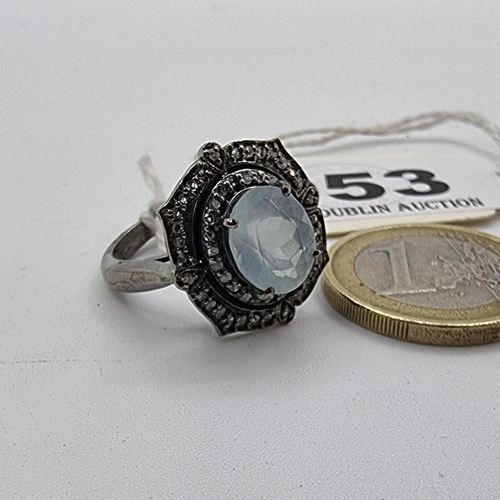 53 - An extremely attractive large aquamarine stone ring with diamond cluster surround. Weight 6g, size O... 