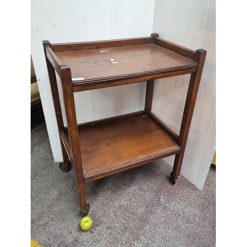 545 - A handsome two-tiered drinks trolley This table is in excellent condition. Height - 77cm. Width - 61... 