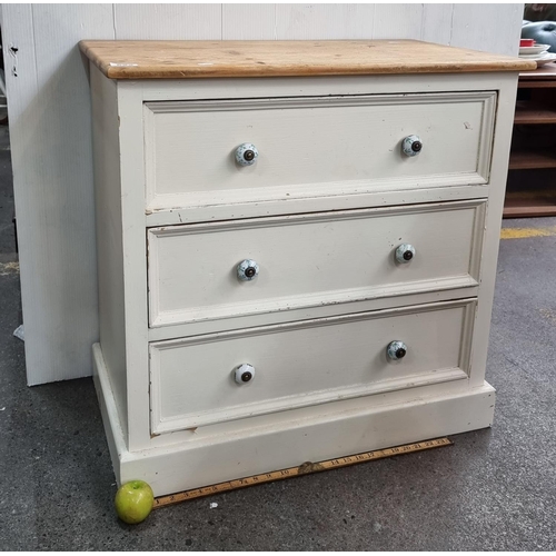 622 - Painted pine three-drawer chest with very pretty painted glass handles.