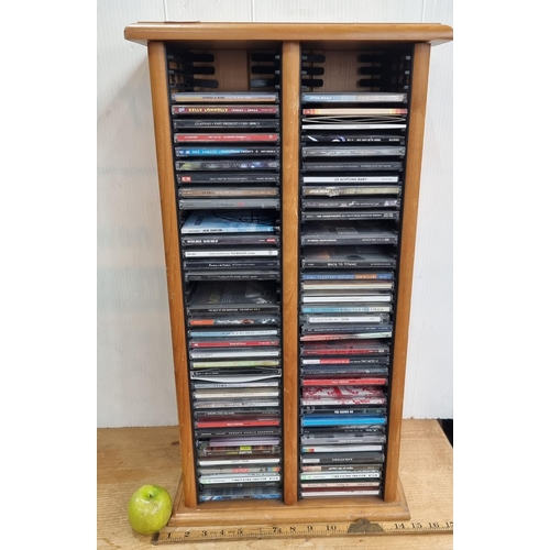 623 - A Wooden CD Rack Containing Rock, Pop, Soundtrack and Traditional Irish CDs.