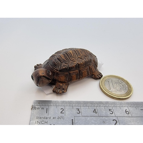 7 - A nicely carved netsuke boxwood figure of a tortoise with extremely precise carving.