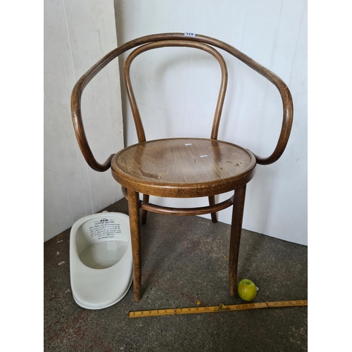 774 - Irish large bentwood armchair and slip bedpan.