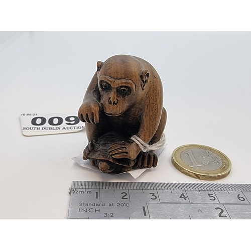 9 - A very nicely designed carved boxwood netsuke of a chimp sitting astride a turtle. With stamped make... 