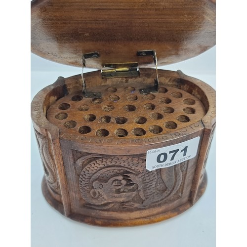 71 - A vintage highly decoratively carved Chinese Dragon cigarette box of oval form, with carvings to top... 