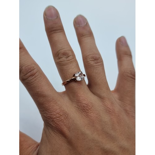 72 - A sterling silver rose gold toned solitaire ring. Weight 3g, size R. Together with a double strand p... 