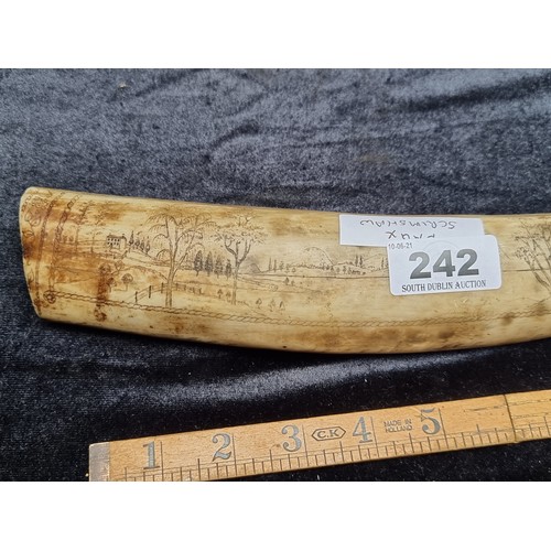 242 - An American Faux Scrimshaw Tusk with Engravings of an Eagle and Country Scene.