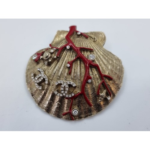 403 - Star Lot : Designer Chanel enamel brooch (made in France) with Chanel motif with gem stone accents. ... 