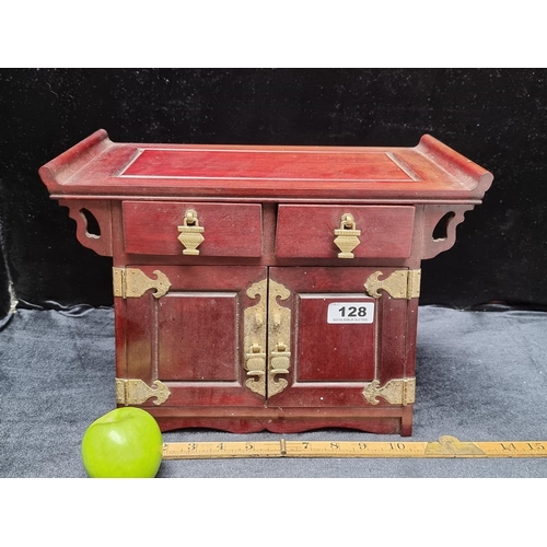 128 - A Stunning Wooden Chinese Jewellery Box with a Beautiful Red Silk Interior and Ornate Brass Detail.