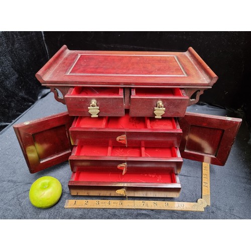 128 - A Stunning Wooden Chinese Jewellery Box with a Beautiful Red Silk Interior and Ornate Brass Detail.