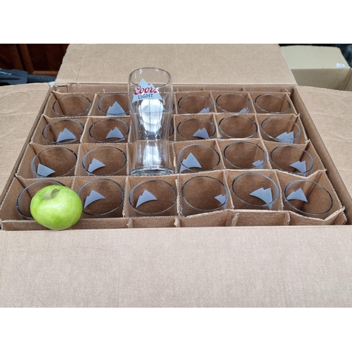 543 - A box filled with 24  Coors Light pint glasses.