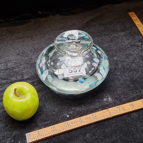 557 - Very heavy art glass handblown flat bottom bud vase with aqua floral designs.