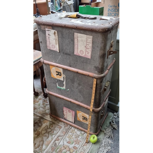 570 - Vintage travel trunk with lots of travel labels