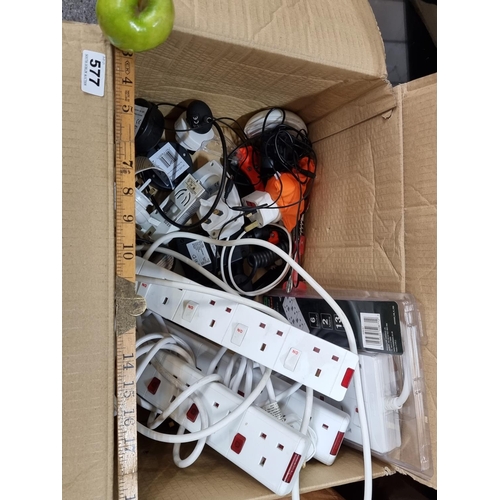 577 - Good box of electricals including 12v 220v adaptors, extension blocks etc.