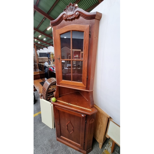 594 - A Single Door Corner Cabinet with Bottom Storage and Scallop and Scroll Detail with Original Key.