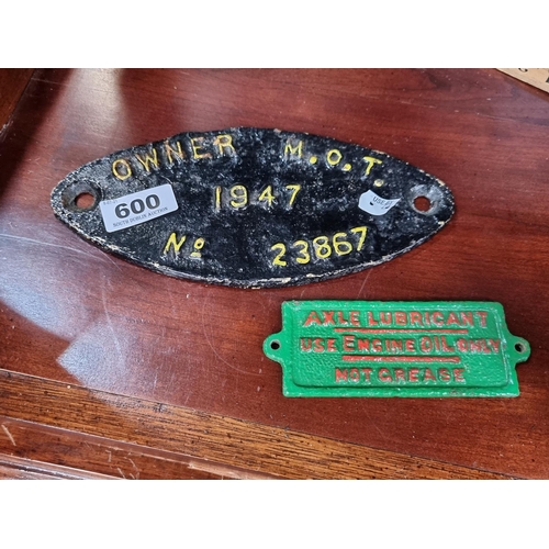 600 - Pair of vintage style  cast iron plaques. A green axle lubricant sign and an Owner M.O.T sign. Great... 