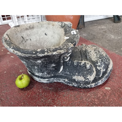 644 - A Large antique heavy Garden Flower Pot in The Shape of a huge Boot.