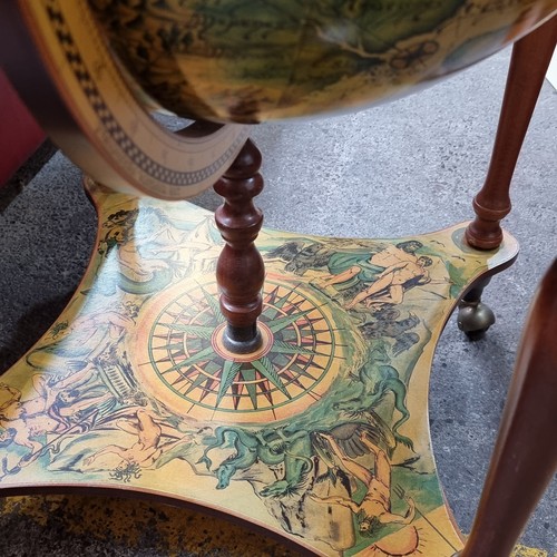 595 - An impressive large Globe Drinking Cabinet - profusely decorated with Medieval style illustration bo... 