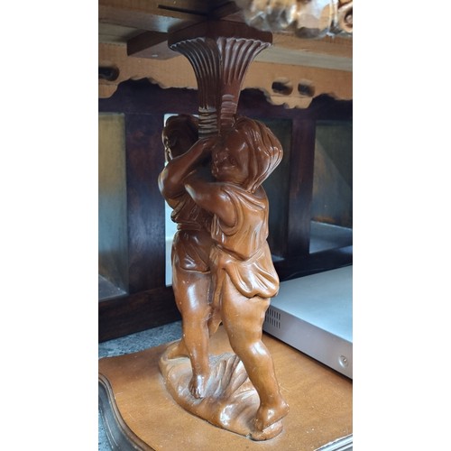 591 - A Stunning Profusely Carved Rococo Style Coffee Table with a Fitted Glass Saver Top and figural cher... 