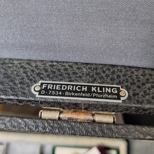 548 - A commercial jewellery vendors travel case with ten removable presentation trays and a large collect... 