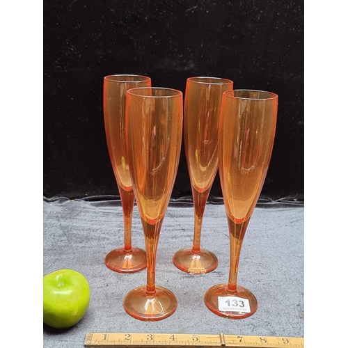 133 - A Set of 4 Heavy Coloured Champagne Flutes by Maison Balzac. Expensive new.