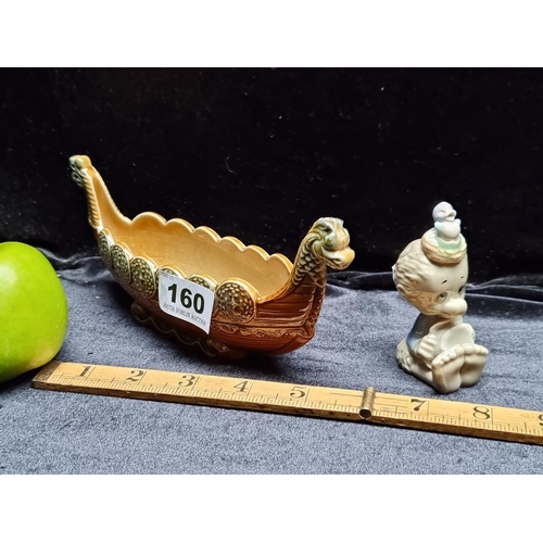 160 - A Wade Porcelain Viking Ship Figure with a wade Walt Kelly 