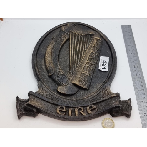 421 - A heavy cast oval metal plate. Insignia with Irish harp, with Eire stamped to base.