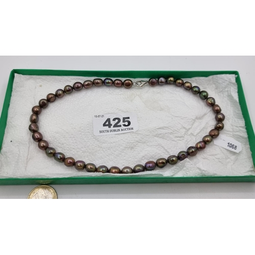 425 - A cultured pearl necklace, containing 43 graded black pearls, with silver clasp.