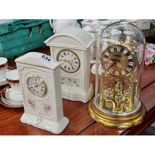 634 - Three clocks including Donegal China Rose strand clock, a Belleek clock and a quartz Torsion Pendulu... 