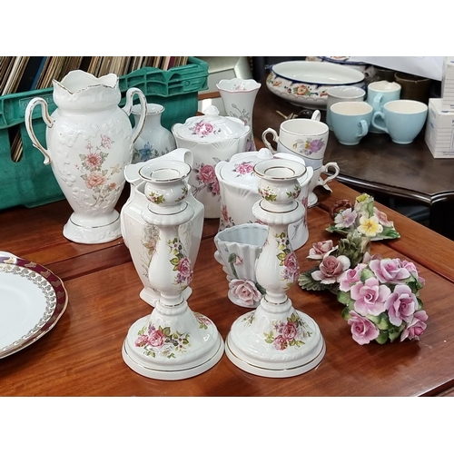 635 - Large collection of porcelain items including James Kent Old Foley Staffordshire candlesticks. (12)