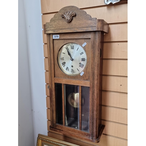 79 - Antique H.A.C wall clock with chime and oak body made in Wurttemberg with bevelled glass panelled do... 