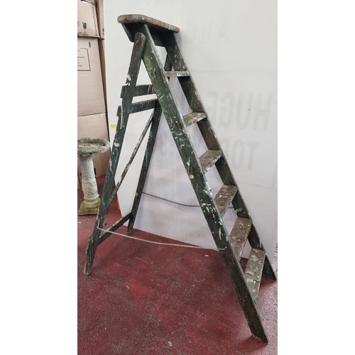 751 - A folding wooden step ladder - 145cm tall.