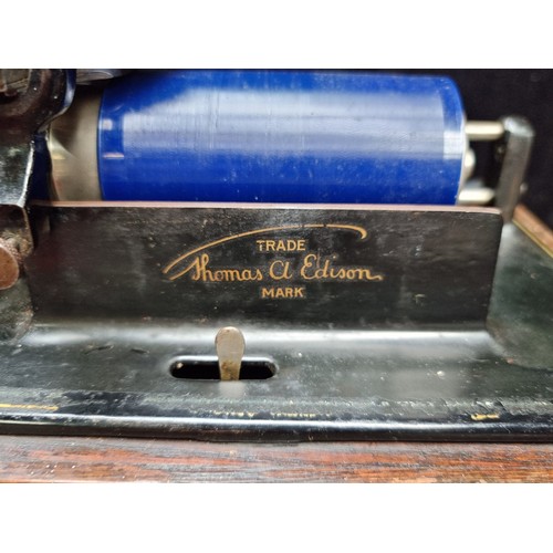 240 - An antique Thomas A Edison, hand-cranked early fireside phonograph with replacement horn.