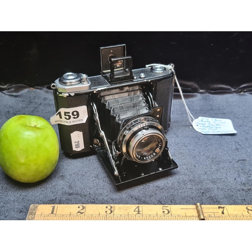 A Zeiss Ikon Ikonta 521/16 Folding Camera - With Leather Case
