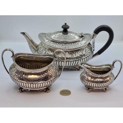 1 - Three piece sterling silver tea set, a teapot, sugar bowl and cream jug. All pieces profusely decora... 