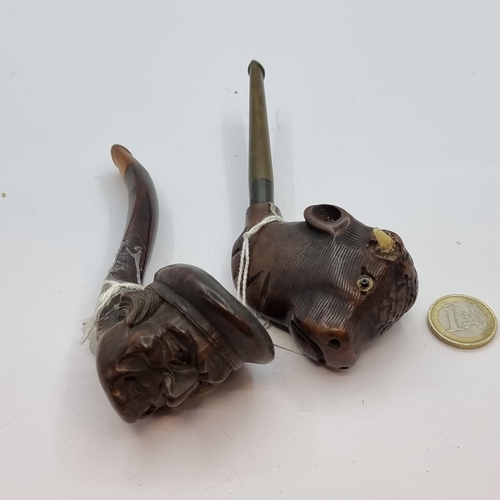 64 - Two interesting vintage  hand carved pipes, depicting a bulls head and male figure.