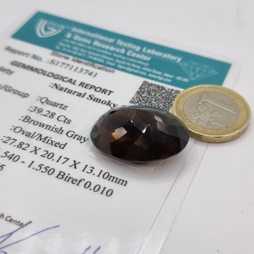 68 - An oval facet cut natural smoky quartz stone. Weight 39.228 carats. Comes with certificate. Large im... 