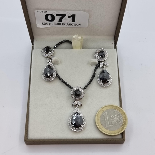 71 - A three piece suite of Sterling Silver jewellery, consisting of a polished Black Onyx  pendant neckl... 