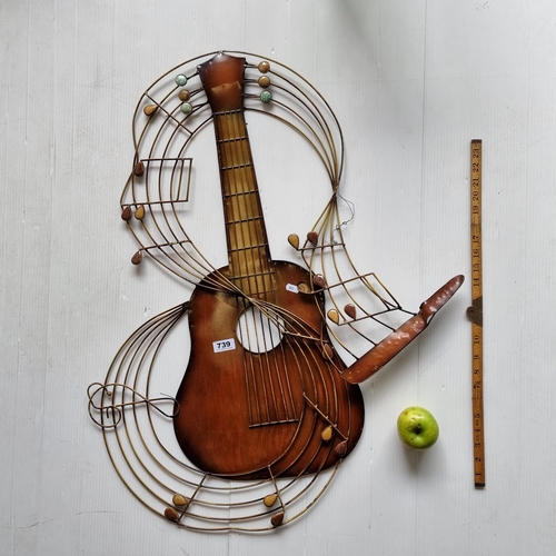 739 - A large, worked metal guitar music sculpture wall hanging.