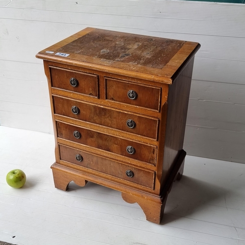 744 - A very neat sized chest of drawers with five drawers and drop ring handles. Mm: 55cm x 42cm x 30cm.