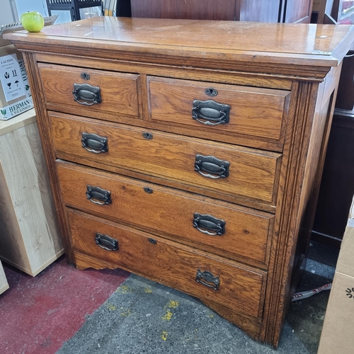 747 - A handsome antique golden oak chest with five drawers and heavy brass handles. Very nicely proportio... 